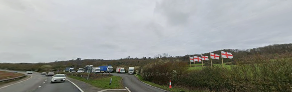 photo of layby with 5 English flags flying